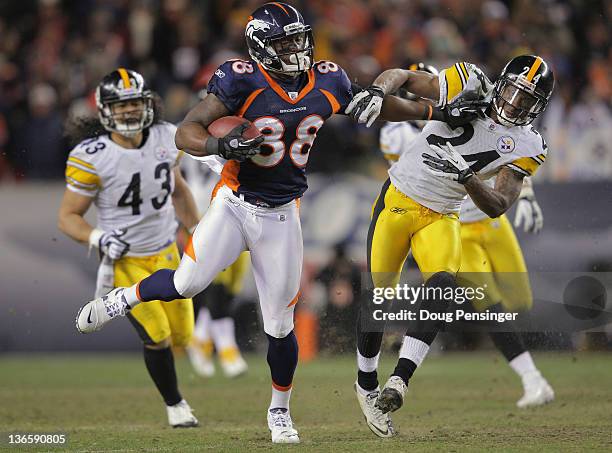 Demaryius Thomas of the Denver Broncos makes a pass reception and fights off Ike Taylor of the Pittsburgh Steelers to go 80 yards for the game...