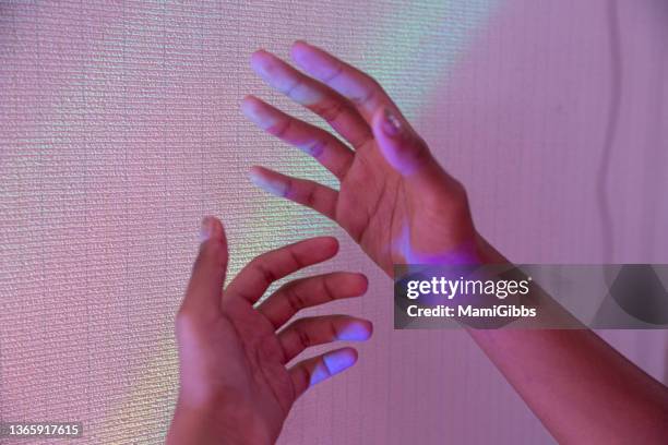 Human Hands With Pink Light High-Res Stock Photo - Getty Images