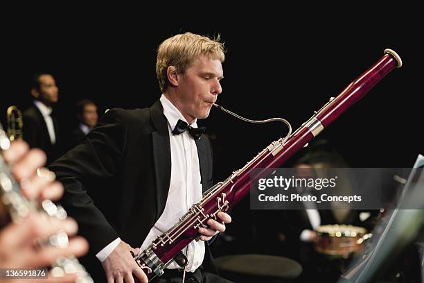 fagotto player in orchestra - musician foto e immagini stock