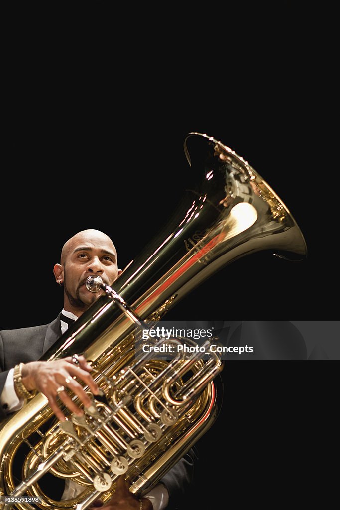 Tuba player in orchestra