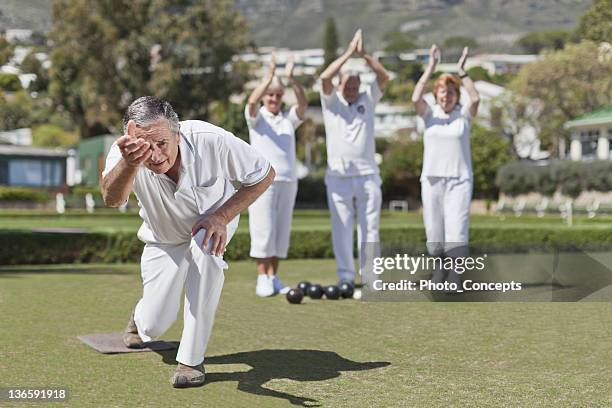 older people playing lawn bowling - lawn bowls stock pictures, royalty-free photos & images