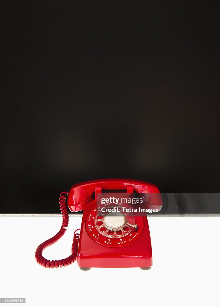 Studio shot of red phone