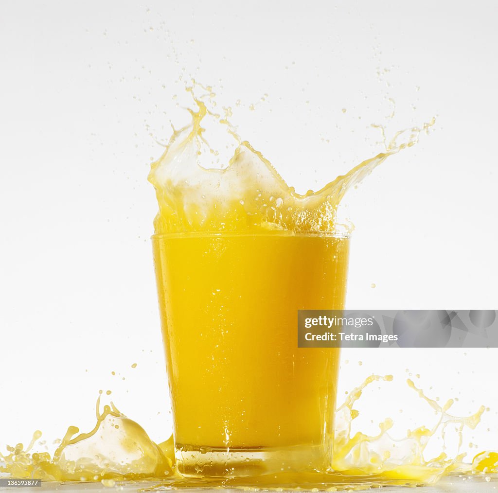 Studio shot of orange juice with splash