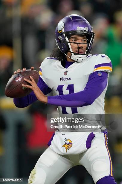 Kellen Mond of the Minnesota Vikings looks to pass the ball against the Green Bay Packers in the second half at Lambeau Field on January 02, 2022 in...