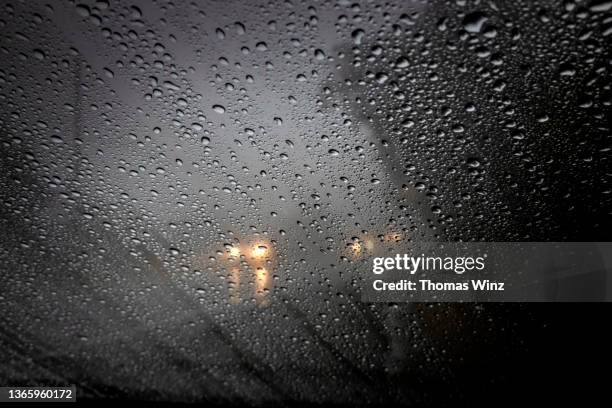 looking at headlights through a wet windshield - wet see through stock pictures, royalty-free photos & images