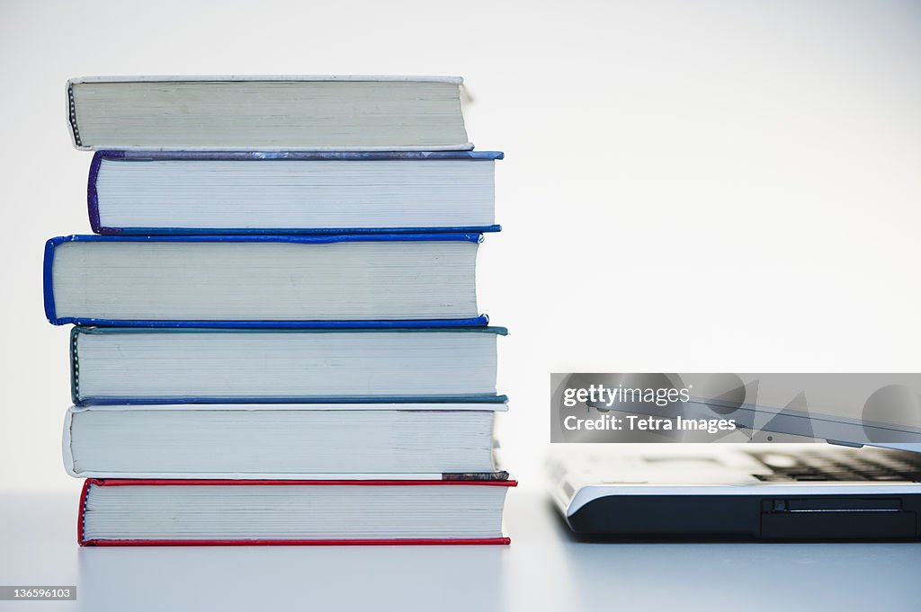 Studio shot of books and laptop