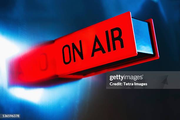 studio shot of on air glowing sign - broadcasting stock pictures, royalty-free photos & images