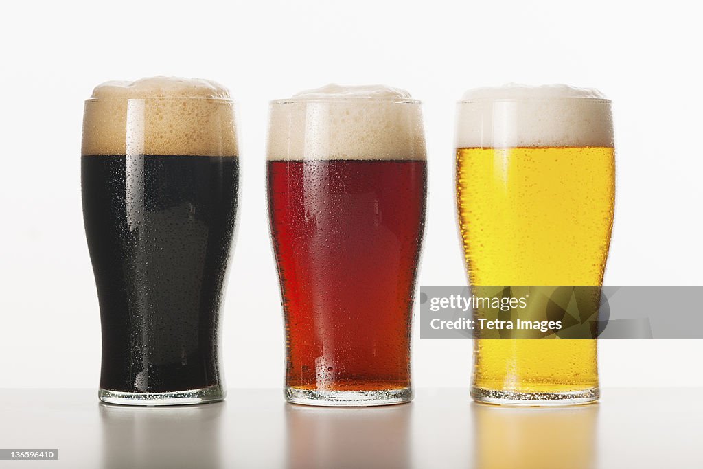 Three beers in glasses, studio shot