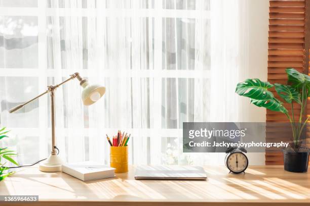 laptop and office supplies on home office desk - desk stock pictures, royalty-free photos & images