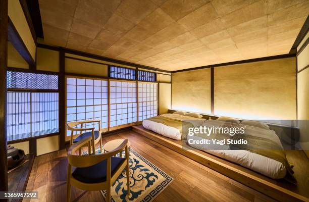 japanese-style rooms in a traditional kyoto machiya renovated into a modern hotel. - traditional japanese bed stock pictures, royalty-free photos & images