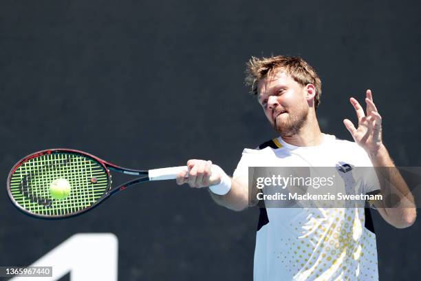 Kevin Krawietz of Germany plays a forehand in his second round doubles match against Sam Querrey and Austin Krajicek of United States during day five...