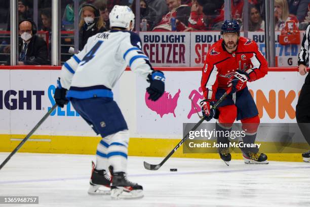 Alex Ovechkin of the Washington Capitals carries the puck into the zone during a game against the Winnipeg Jets at Capital One Arena on January 18,...