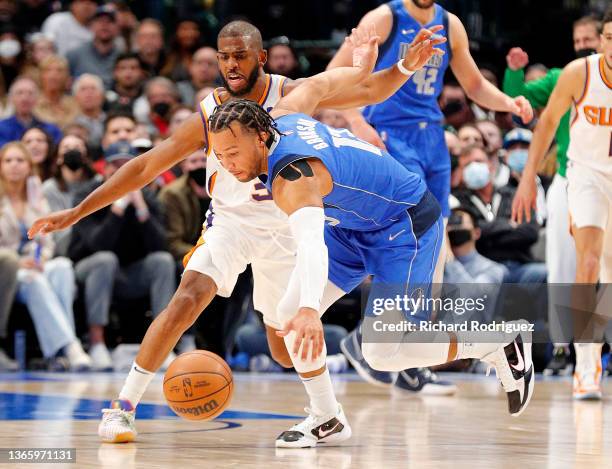 Chris Paul of the Phoenix Suns guards Jalen Brunson of the Dallas Mavericks as he loses the ball briefly in the second half at American Airlines...