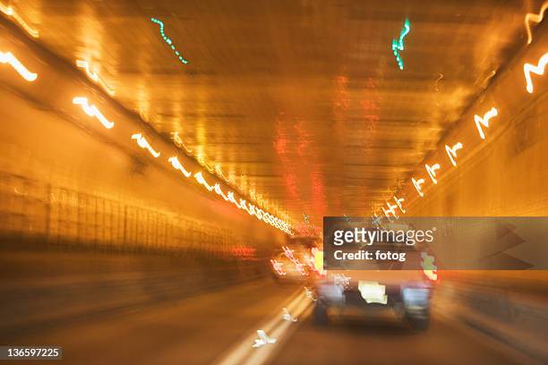 usa, new york state, new york city, manhattan, cars in tunnel, blurred motion - lincoln tunnel stockfoto's en -beelden
