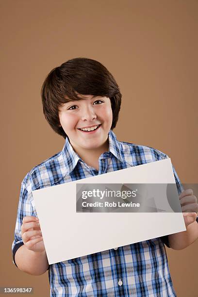 Boy Using Paper 7,489 Boy Holding A Paper Stock Photos, High-Res Pictures, and Images ...
