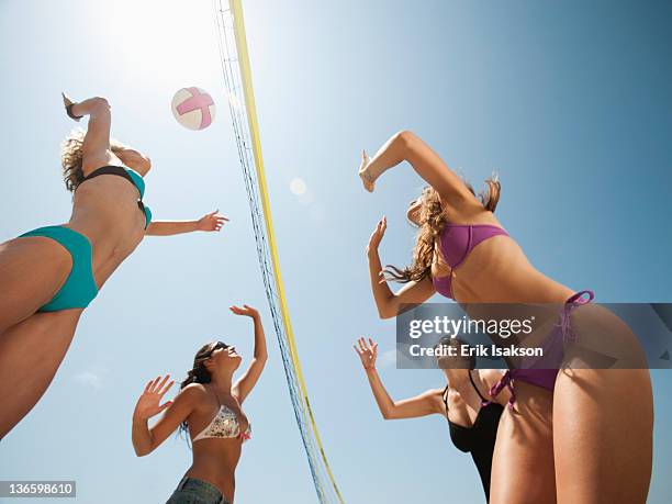 usa, california, malibu, group of young women playing beach volleyball - malibu beach california stock pictures, royalty-free photos & images