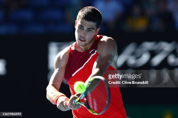 Carlos Alcaraz of Spain plays a backhand in his third round singles match against Matteo Berrettini of Italy during day five of the 2022 Australian...