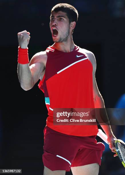 Carlos Alcaraz of Spain celebrates winning set point in his third round singles match against Matteo Berrettini of Italy during day five of the 2022...
