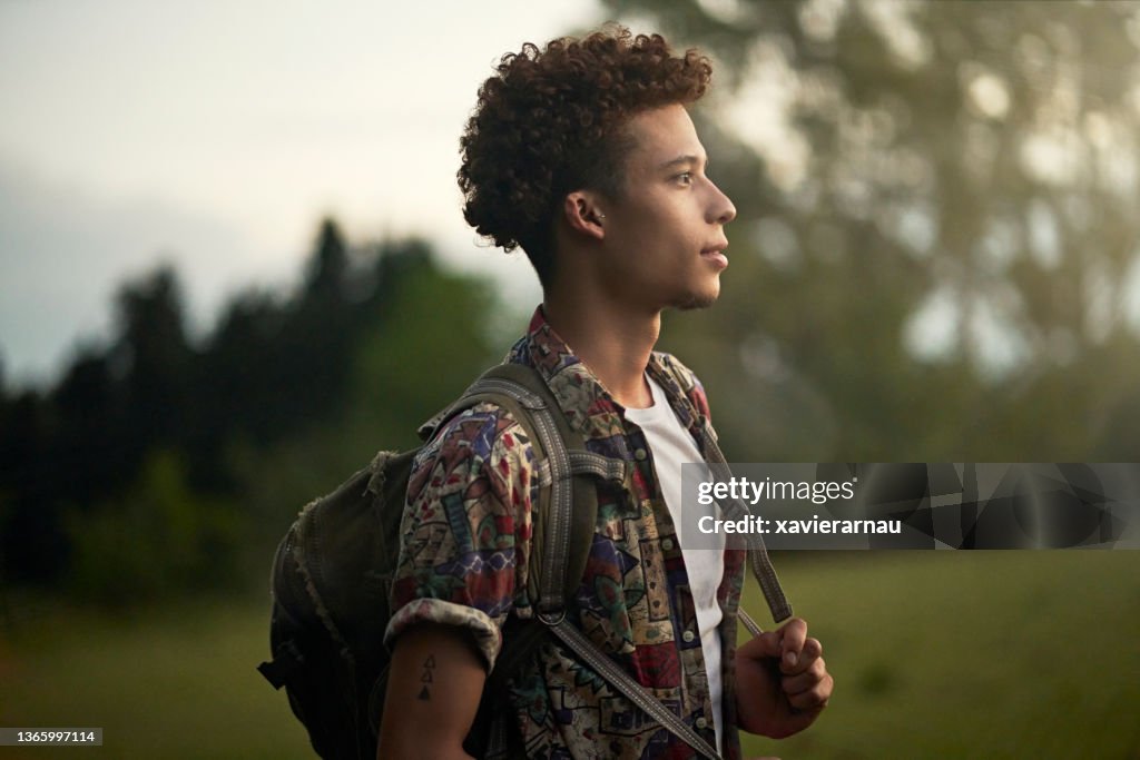 Outdoor portrait of young African-American backpacker