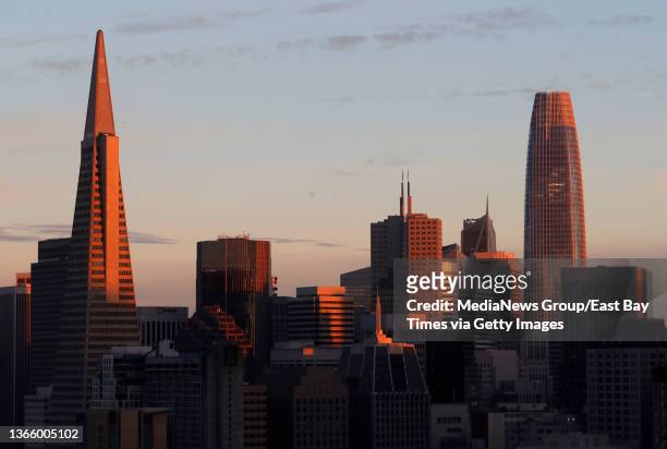 The Transamerica Pyramid and Sales Force tower are seen at sunset in San Francisco, Calif., on Monday, Jan. 17, 2022.