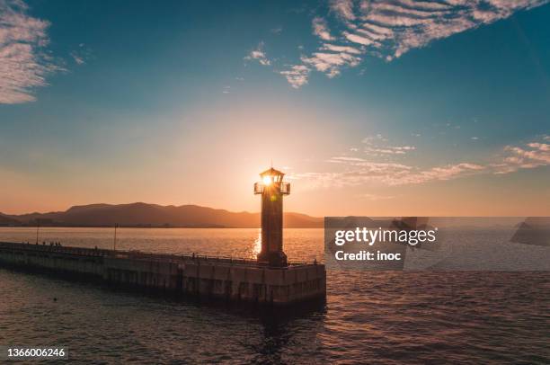 lighthouse and sunset - 高松市 ストックフォトと画像