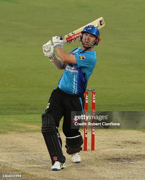 Travis Head of the Strikers hits out during the Men's Big Bash League The Eliminator Final match between the Adelaide Strikers and the Hobart...