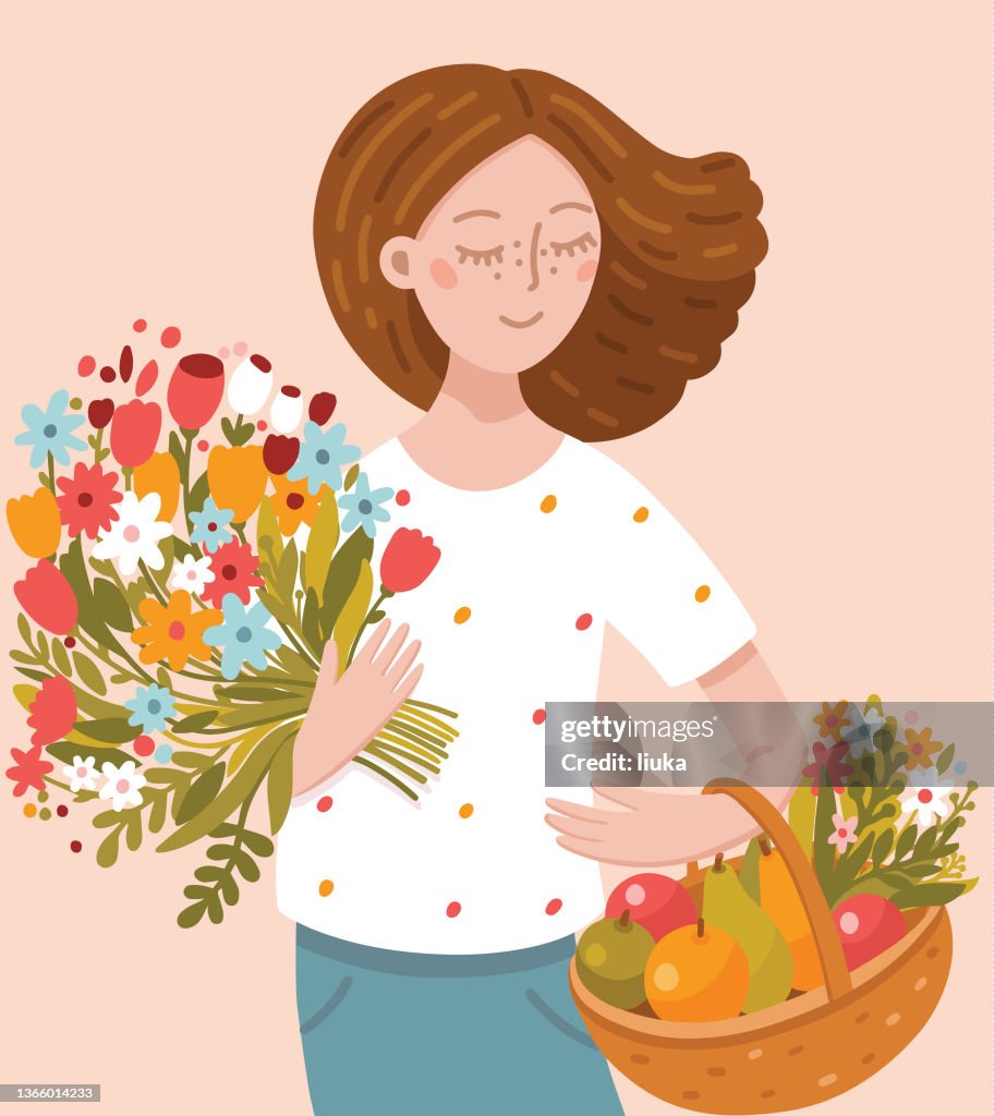 Junge Frau mit Blumenstrauß und Obstkorb