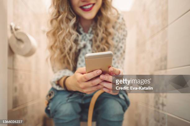 young woman at home - woman toilet stock pictures, royalty-free photos & images