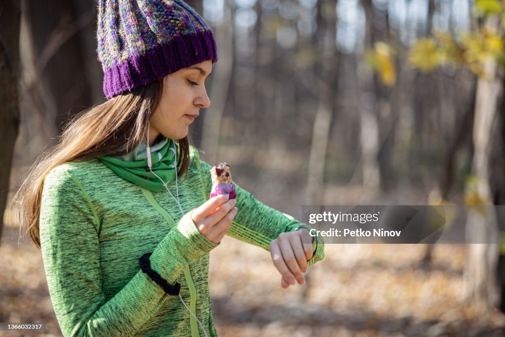 Young girl eating power bar