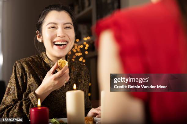 woman laughing,having dinner with girlfriend. - candle light dinner stock pictures, royalty-free photos & images