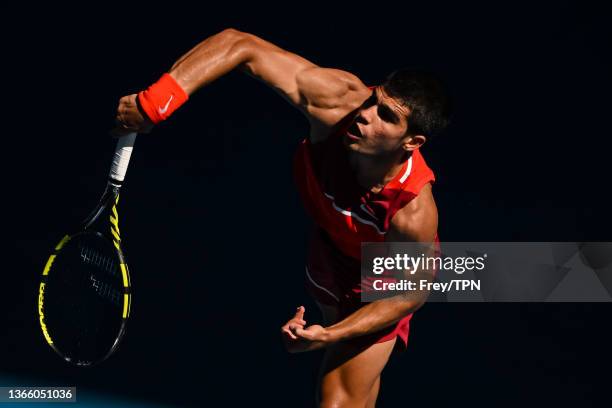 Carlos Alcaraz of Spain serves against Matteo Berrettini of Italy during day five of the 2022 Australian Open at Melbourne Park on January 21, 2022...