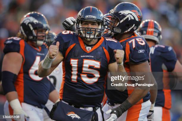 Quarterback Tim Tebow of the Denver Broncos celebrates his second quarter rushing touchdown against the Pittsburgh Steelers at Sports Authority Field...