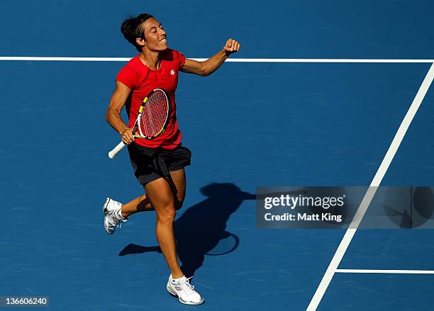 Francesca Schiavone of Italy celebrates winning match point in her first round singles match against Samantha Stosur of Australia during day two of...