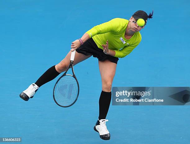 Bethanie Mattek-Sands of the USA returns a shot to Ashleigh Barty of Australia during day two of the 2012 Hobart International at the Domain Tennis...