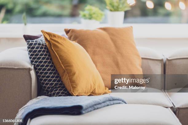 pillows on a couch in the living room. decoration service at a garden party, summer festival, or wedding. catering. - cushion stock photos et images de collection
