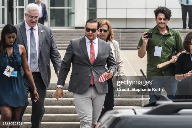 Rep. George Santos departs with his lawyer Joseph Murray from the federal courthouse on June 30, 2023 in Central Islip, New York. Rep. George Santos...