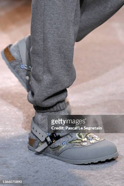 Model, shoe detail, walks the runway during the Dior Homme Menswear Fall/Winter 2022-2023 show as part of Paris Fashion Week on January 21, 2022 in...