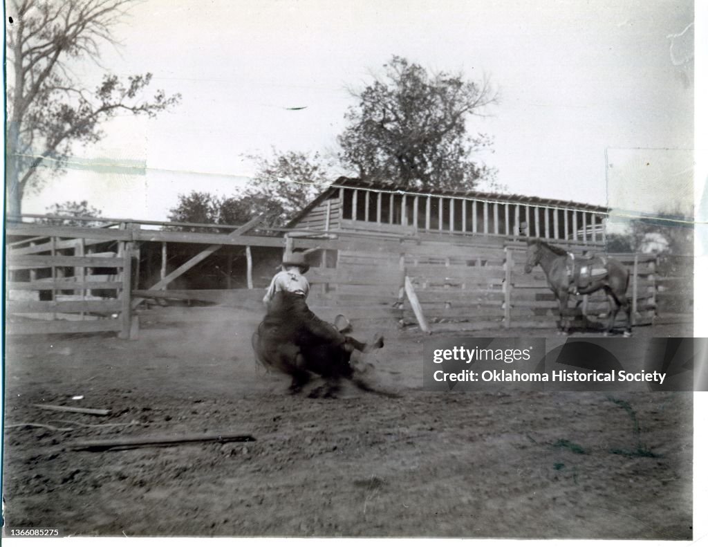 Bulldogging Wreck An unidentified rodeo performer wrestles a steer during a 'Wild West ...
