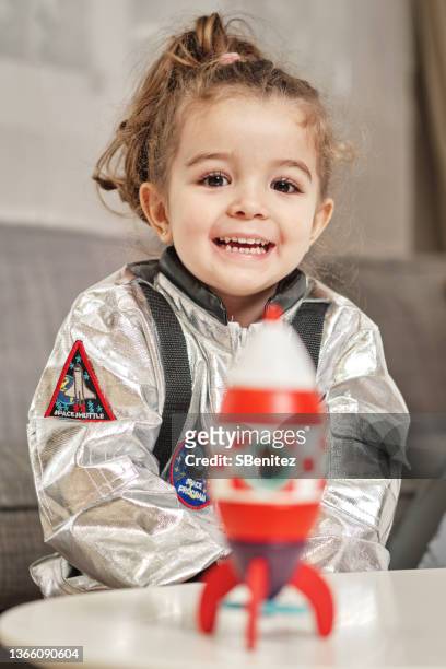 little astronaut happy to finish her rocket - astronaut portrait stock-fotos und bilder
