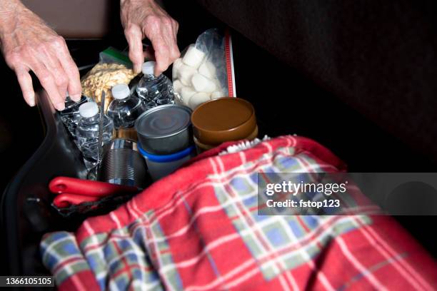 lv senior man prepares for roadside emergency with survival items in his truck. - emergency planning stockfoto's en -beelden