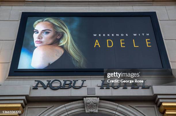 Promotional billboard touting the upcoming concerts by singer Adele is viewed outside Caesars Palace Hotel & Casino on January 9, 2022 in Las Vegas,...