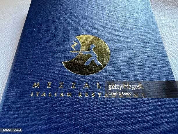 Menu with logo at Mezzaluna by the Sea, an Italian cuisine restaurant in Half Moon Bay, California, January 2, 2022. Photo courtesy Sftm.