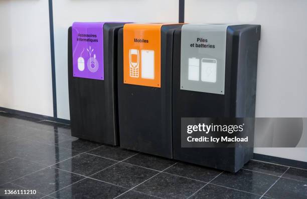 three selective sorting bins to help the population sort electronic waste (right view) - lithium ion battery stock pictures, royalty-free photos & images