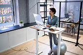 Adjustable Height Desk Stand In Office