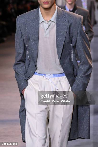 Model, fashion detail, walks the runway during the Dior Homme Menswear Fall/Winter 2022-2023 show as part of Paris Fashion Week on January 21, 2022...