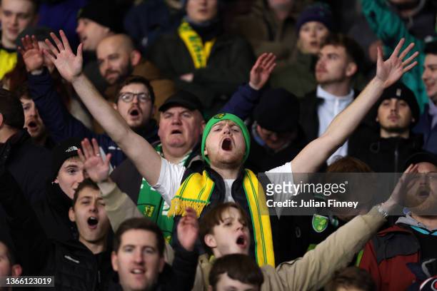 Norwich fans show their support prior to the Premier League match between Watford and Norwich City at Vicarage Road on January 21, 2022 in Watford,...
