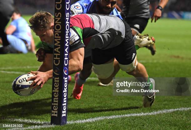 Harlequins number 8 Alex Dombrandt scores the opening Harlequins try in the corner during the Heineken Champions Cup match between Harlequins and...