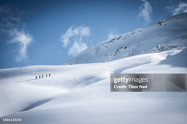 mountain landscape with skiers in it - off piste stock pictures, royalty-free photos & images