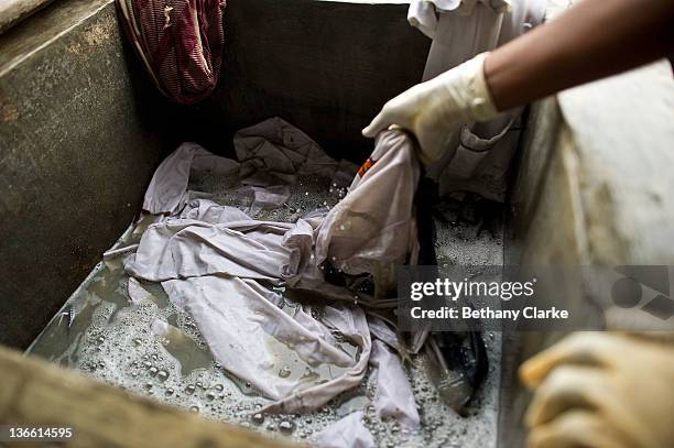 Laundry workers wash clothes at Dhobi Ghat on November 4, 2011 in Mumbai, India. Dhobi Ghat is known as the world's largest laundry with 800 wash...