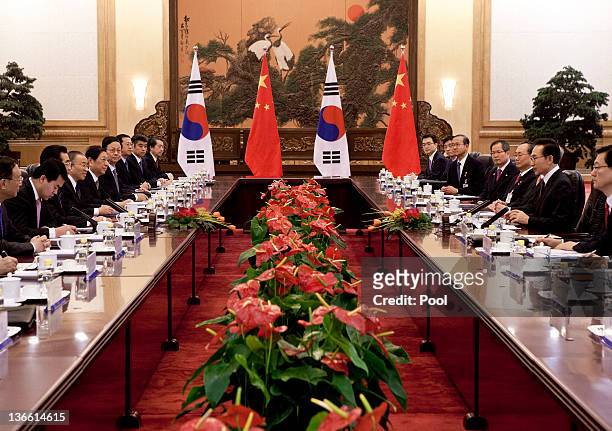 South Korean President Lee Myung-bak, second from right, and his Chinese counterpart Hu Jintao attend a bilateral meeting at the Great Hall of the...